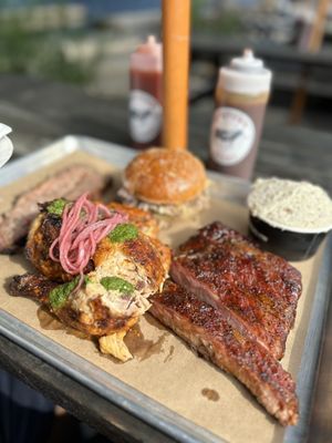 Hometown Bar-B-Que signature dishes Wings, Pulled Pork Sandwich, Beef Ribs, Brisket.